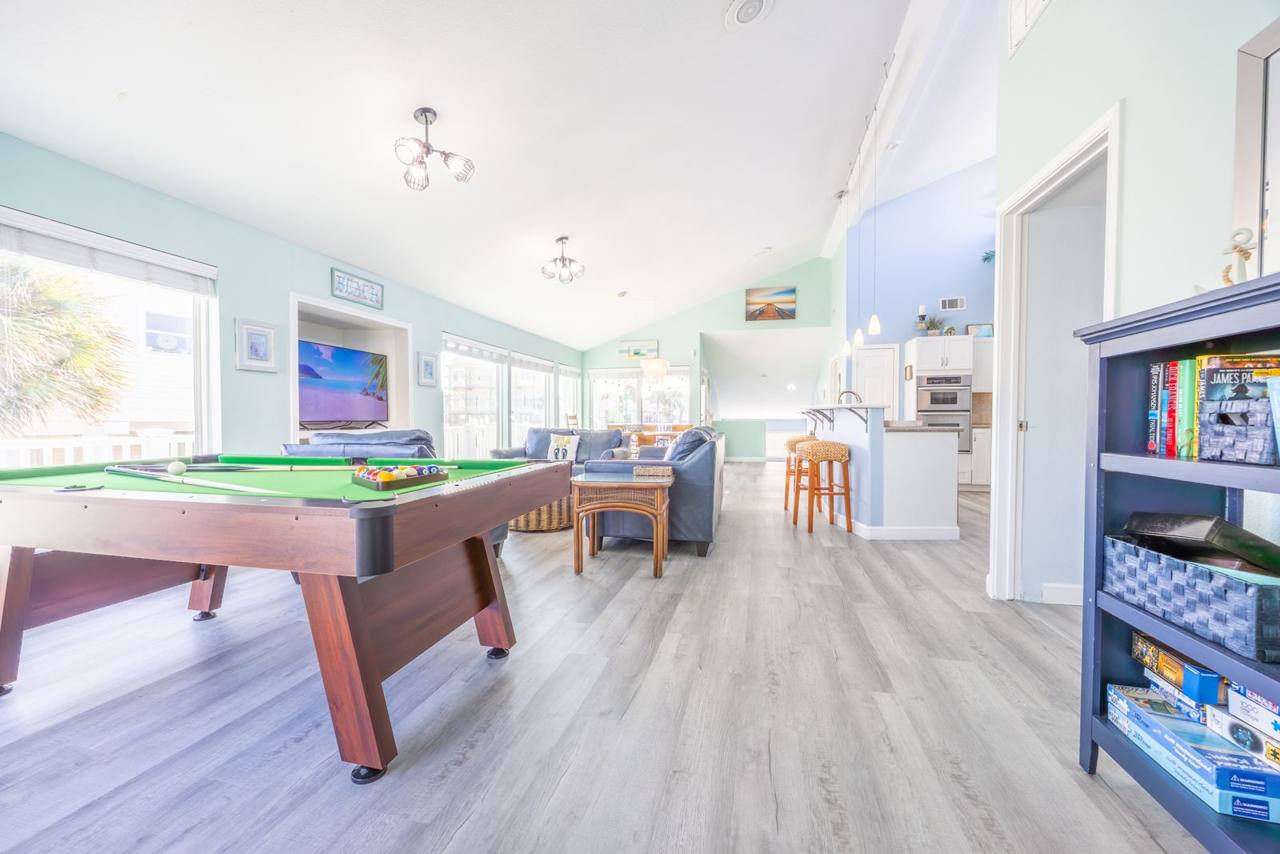 Pool table, books and puzzles in the open living space